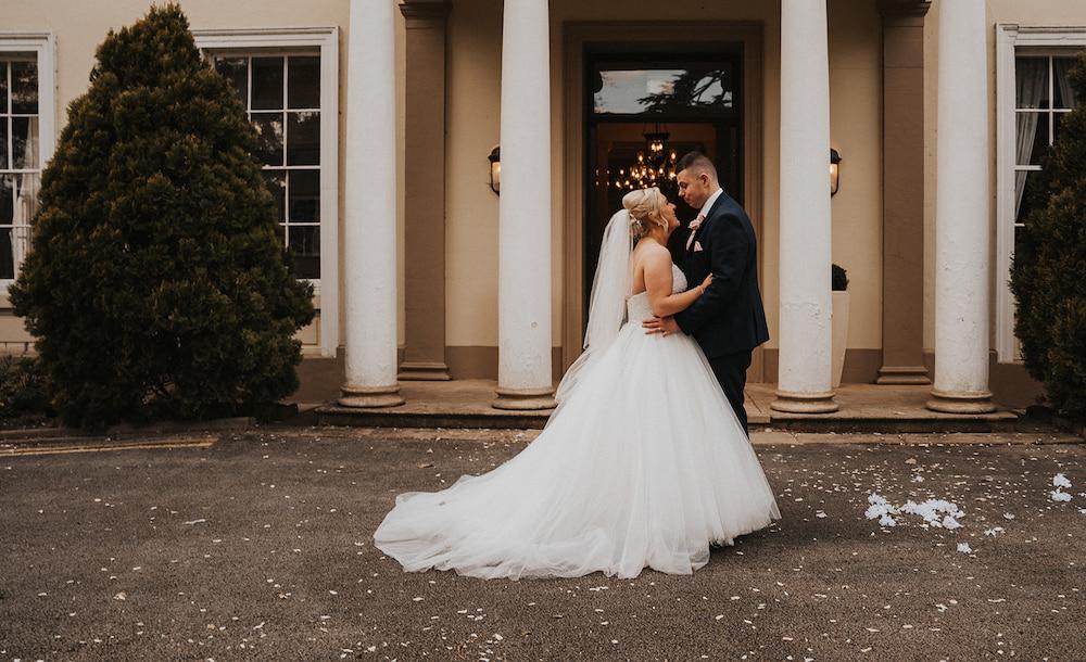 Bride and Groom outside Eastwood Hall manor house in Nottinghamshire.